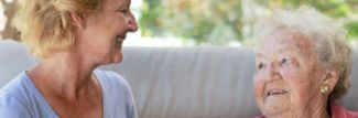 Two women smiling, Elk Run Assisted Living in Evergreen, CO