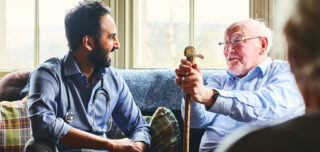 Elderspeak, doctor talking with man, Elk Run Assisted Living in Evergreen, CO